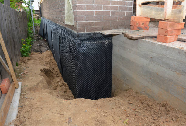 SJ Waterproofing Pros technician performing targeted Exterior Waterproofing assessment in Mattoon, IL